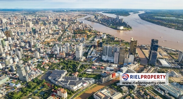 Phnom Penh city skyline featuring BKK1 high-rise condominiums and modern skyscrapers at dusk, illustrating the growth of Cambodia's real estate market for international investors.