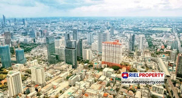 Panorama of Phnom Penh's BKK1 skyline at dusk, showcasing luxury condominium developments like Time Square and J Tower for 2026 investors.